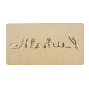 Etiqueta Signo de palabra Aloha en la arena de la playa