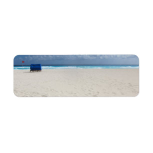 Etiqueta Una silla de playa espera