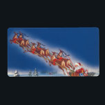 Etiqueta Vintage Christmas, Santa Flying Sleigh w Reindeer<br><div class="desc">Ilustracion de la Vintage. Imagen de feriado navideño con un alegre Santa Claus con su reno. Están volando su trineo lleno de juguetes a través del cielo azul y sobre un pueblo dormido cubierto de nieve en invierno en la víspera de los Navidades. Ho, ho, ho Happy Holidays and Season's...</div>