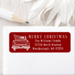 Etiqueta Vintage Red Truck Merry Christmas Return Address<br><div class="desc">Esta etiqueta de dirección de Feliz Navidad muestra la línea blanca de un camión vintage que lleva un árbol de Navidad sobre un fondo rojo con ráfagas de nieve. Personaliza con tu nombre y dirección. Diseñado por los artistas ©Tim Coffey y Susan Coffey.</div>