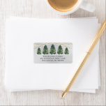 Etiqueta Watercolor Christmas Tree Farm Gray Return Address<br><div class="desc">Festive custom holiday address label design features a rustic chic winter scene from a Christmas tree farm and a snowy gray winter background. Includes a row of green watercolor painted pine trees with string lights. Personalize the simple charcoal gray wording with your family's return address text. Makes a beautiful accent...</div>