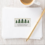 Etiqueta Watercolor Christmas Tree Farm Wood Return Address<br><div class="desc">El diseño de la etiqueta de la dirección festiva personalizado incluye una escena de invierno de moda rústica de una granja de árboles de Navidad y fondo de grano de madera blanqueado. Incluye una hilera de pinos pintados de color verde agua con luces de cuerda. Personalice la sencilla redacción en...</div>