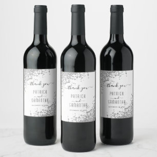 Etiquetas de vino con purpurina plateada y vino es