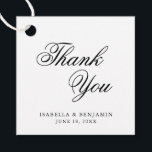 Etiquetas Para Recuerdos Gracias Elegante Boda de caligrafía blanca negra<br><div class="desc">Elegante tipografía etiquetas de favores de boda con un diseño simple con el mensaje "Gracias" en caligrafía negra y sus nombres y fecha abajo, sobre un fondo blanco. Las fuentes y los colores de fondo pueden cambiarse a los colores que desee. Estas etiquetas elegantes y elegantes son ideales para un...</div>