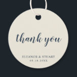 Etiquetas Para Recuerdos Gracias Simple Color Sólido Boda Ivory<br><div class="desc">Etiquetas de agradecimiento de boda de color sólido básico con un diseño minimalista con el mensaje, "gracias" en una elegante fuente de escritura azul marino, y su nombre y fecha en una fuente serif, sobre un fondo marfil. Las fuentes y colores de fondo pueden ser cambiados a cualquier color que...</div>