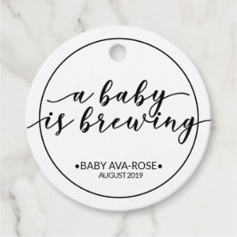 Etiquetas Para Recuerdos Un bebé está preparando una cita de Baby Shower en