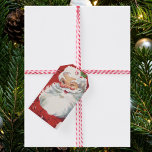 Etiquetas Para Regalos Vintage Christmas, Jolly Santa Claus Winking<br><div class="desc">Easy to personalize Christmas gift tags to create a custom message.
Ho,  ho,  ho,  Merry Christmas! Vintage illustration Christmas holiday design featuring a jolly,  happy Santa Claus winking as if he has a secret. He is wearing a hat with holly leaves.</div>
