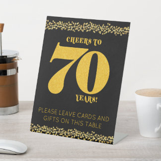 Expositor En L 70 años de vigilia a Purpurina de oro de 70 años