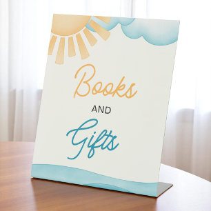 Expositor En L Aquí viene el Rótulo de los libros y regalos de lo
