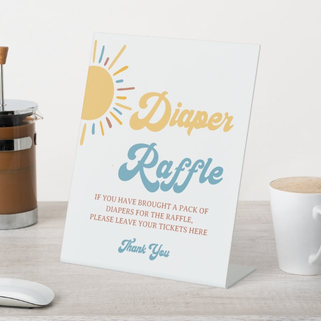 Expositor En L Aquí Viene El Rótulo Son Diaper Raffle (In Situ)