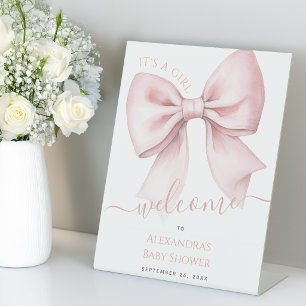 Expositor En L Bienvenida a la fiesta de bebé con lazo rosa Es un