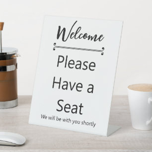 Expositor En L Bienvenido Por Favor Tenga un Asiento Línea Decora