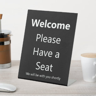Expositor En L Bienvenido Por Favor Tenga un Asiento Negocio Empr