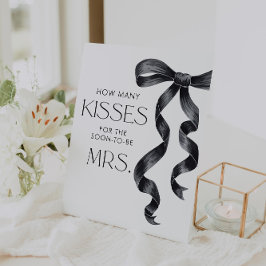 Expositor En L Está atando el nudo adivina cuántos besos