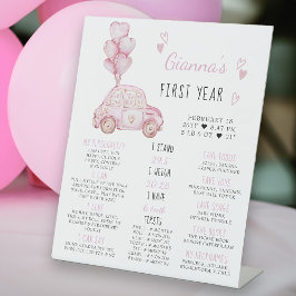 Expositor En L Globos rosados y Rótulo del primer aniversario del