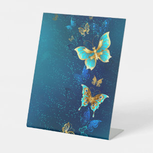 Expositor En L Mariposas doradas sobre fondo azul