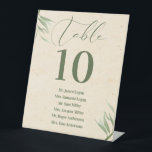 Expositor En L Número de tabla Foliage Verde Papel Beige Ca de ne<br><div class="desc">Este elegante diseño de tarjetas de números de mesa con un follaje verde polvoriento sobre una textura de papel de artesanía beige y personalizable, tipografía elegante en verde oscuro es un diseño sofisticado y elegante en el que se pueden editar textos, imágenes y fuentes. El diseño evoca un ambiente orgánico...</div>