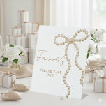 Expositor En L Pearl Bow She's Tying the Knot Bridal Shower Favor<br><div class="desc">Display your favors beautifully with this pearl bow “She’s Tying the Knot” bridal shower favor pedestal sign, designed with a delicate bow motif and elegant typography for a soft, romantic aesthetic. Perfect for favor tables, dessert stations, and gift displays, this sign enhances coquette, feminine, and classy bridal shower themes while...</div>