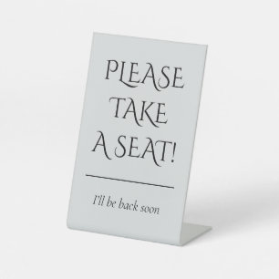 EXPOSITOR EN L "¡POR FAVOR, TOME UN ASIENTO!"