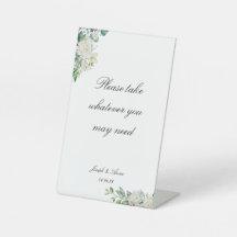 Rótulo en el cuarto de baño con flores blancas per