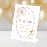 Expositor En L Rótulo Ring Bridal Shower<br><div class="desc">Añade un elemento divertido e interactivo a tu celebración con nuestro cartel de pedestal 'Ring Hunt'. Este letrero, adornado con delicados florales de acuarela y un guión elegante, complementa la colección Elegant Pearls y Prosecco Bridal Shower Collection, proporcionando una encantadora manera de involucrar a los huéspedes en un juego delicioso...</div>