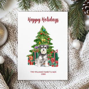 Familia de perro Schnauzer miniatura en Navidad