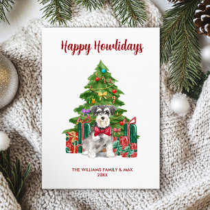 Familia de perro Schnauzer miniatura en Navidad