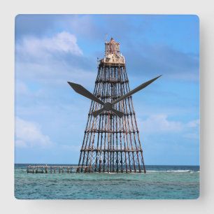 Faro dominante de la arena, reloj de pared