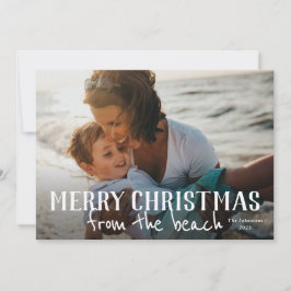 Feliz Navidad desde la tarjeta de vacaciones fotog