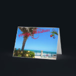 Feliz Navidad desde Vero Beach Florida Oceanfront<br><div class="desc">¡Feliz Navidad desde Vero Beach, Florida! Esta colorida tarjeta de bienvenida con temática tropical muestra una foto de una hermosa zona frente al mar de Vero Beach, todo ello decorado para las vacaciones. El diseño festivo incluye Navidades iluminados por la vegetación, bolas de Navidad colgadas de un frontón de palma...</div>