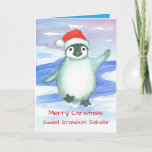 Feliz Navidad Nieto bebé Pingüino Personalizado<br><div class="desc">Una tarjeta de felicitación de Feliz Navidad para un niño que presenta un pingüino dulce con una gorra de Papá Noel rojo brillante bailando en la nieve helada ilustrada con acuarela.</div>