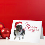 Feliz Navidad Tricolor Corgi Santa Photo<br><div class="desc">Una hermosa fotografía de vacaciones para los amantes del perro,  con un adorable corgi de pozo de pembroke con un sombrero rojo de santa. Feliz Navidad está escrito en rojo al lado de la linda foto.</div>
