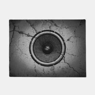 Felpudo Altavoz musical en una pared rota