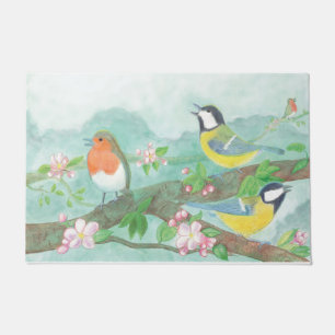 Felpudo Aves cantando en una rama de árbol floreciente
