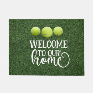 Felpudo Bienvenidos a nuestra casa con una pelota de tenis