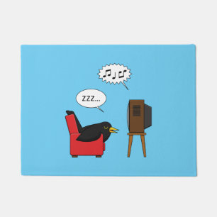 Felpudo Blackbird durmiendo frente al cómic de la TV