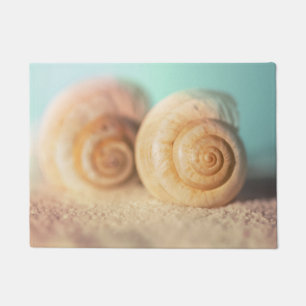 Felpudo Cáscaras del nautilus en la playa