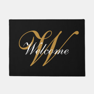 Felpudo Doormat negro y oro monogramado de bienvenida