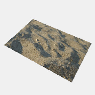 Felpudo El caminar en la arena