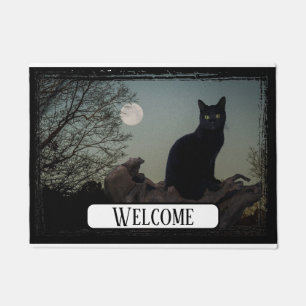 Felpudo Gato negro lunar sobre un árbol