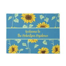 girasoles amarillos verdes hojas fondo azul