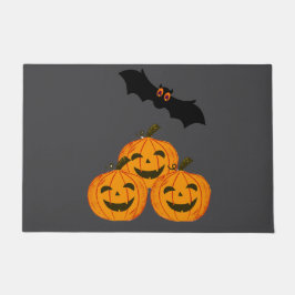 Felpudo Halloween es gracioso. Calabazas y un murciélago v