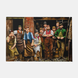 Felpudo Herrero - Los ferreteros de Maidenhead 1900