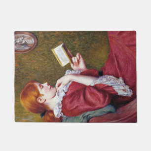 Felpudo Joven con el pelo rojo leyendo un buen libro