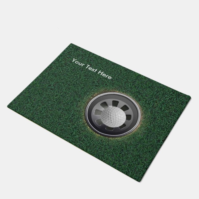 Felpudo La taza, la bola y la hierba del golf PERSONALIZAN (Angular)