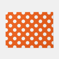 Los puntos de la polka blanca en el naranja