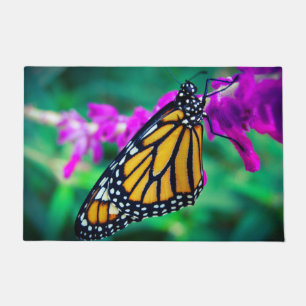 Felpudo Naranja monarca mariposa foto de flor púrpura negr