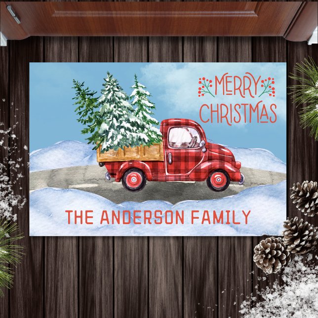 Felpudo Navidades de la familia de la nieve del camión roj (watercolor merry Christmas doormat with buffalo plaid red truck carrying Christmas trees)