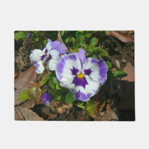 Felpudo Pansias moradas y blancas con flores coloridas