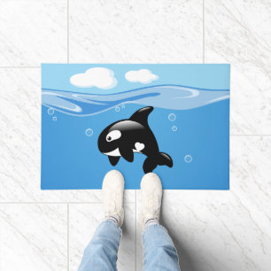 Felpudo Pequeña ballena orca en el océano